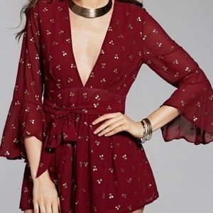 red romper with gold cherries